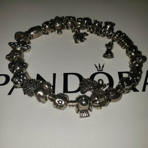Pandora bracelet with 24 Pandora charms. Rare, Retired & Authentic